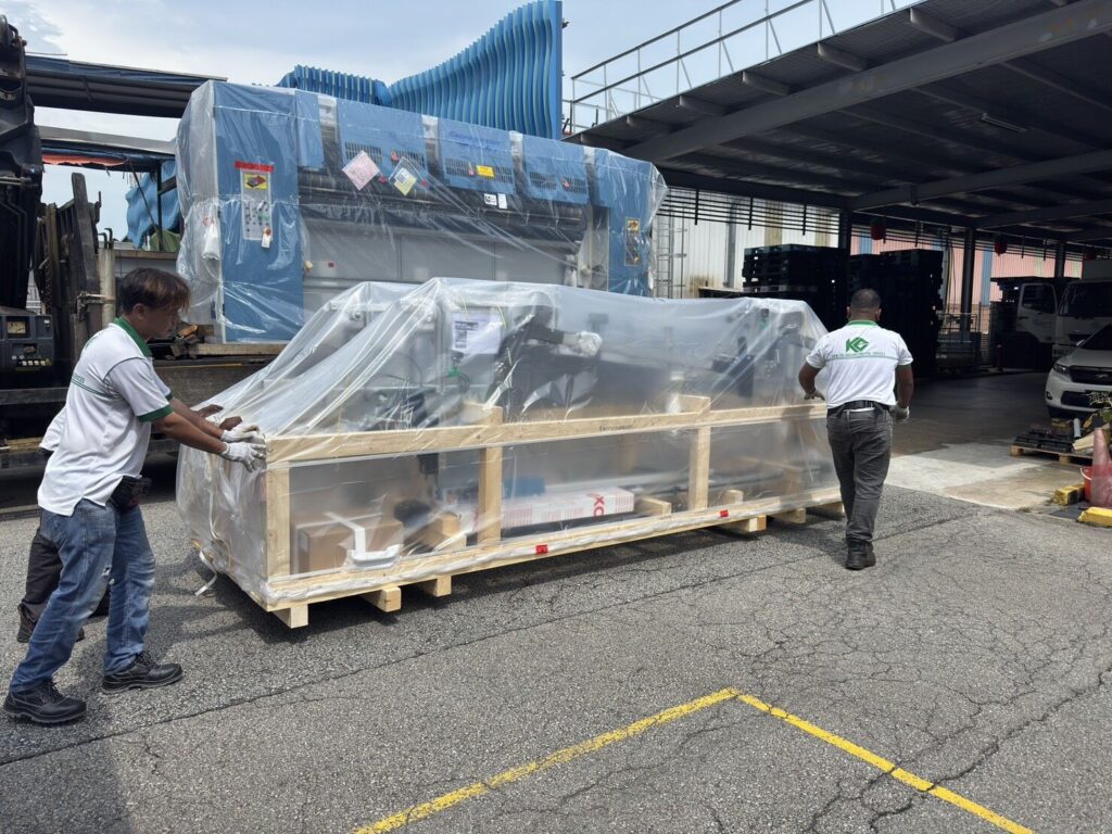 New Kannegiesser high-speed ironer line with camera quality control installed in Singapore